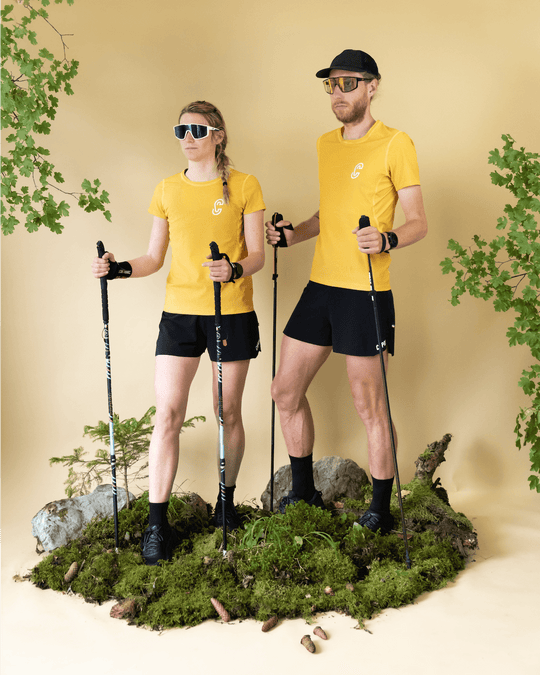 Homme et femme portant le T-Shirt de run Endorphine Caprin colorie jaune #couleur_yellow-stone